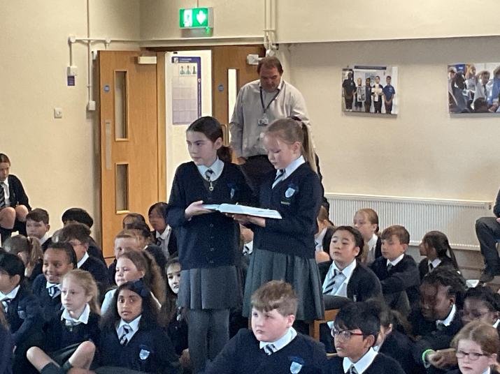 We process with the Bible for the Gospel reading and we all stand. 